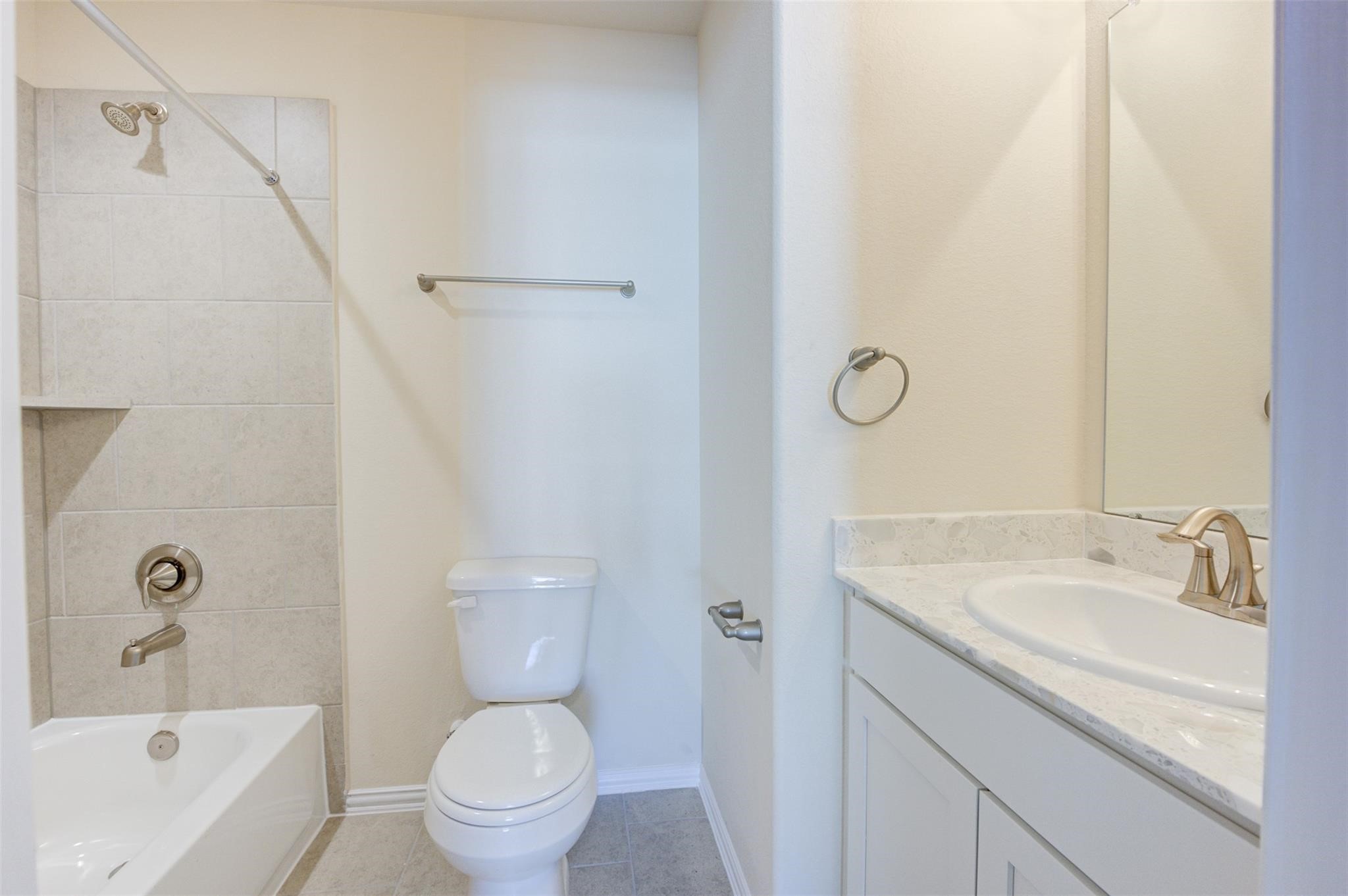 10902 Granite Chief Drive Rosharon, TX 77583 - Photo 26 of 32 a bathroom with a granite countertop sink a toilet and shower