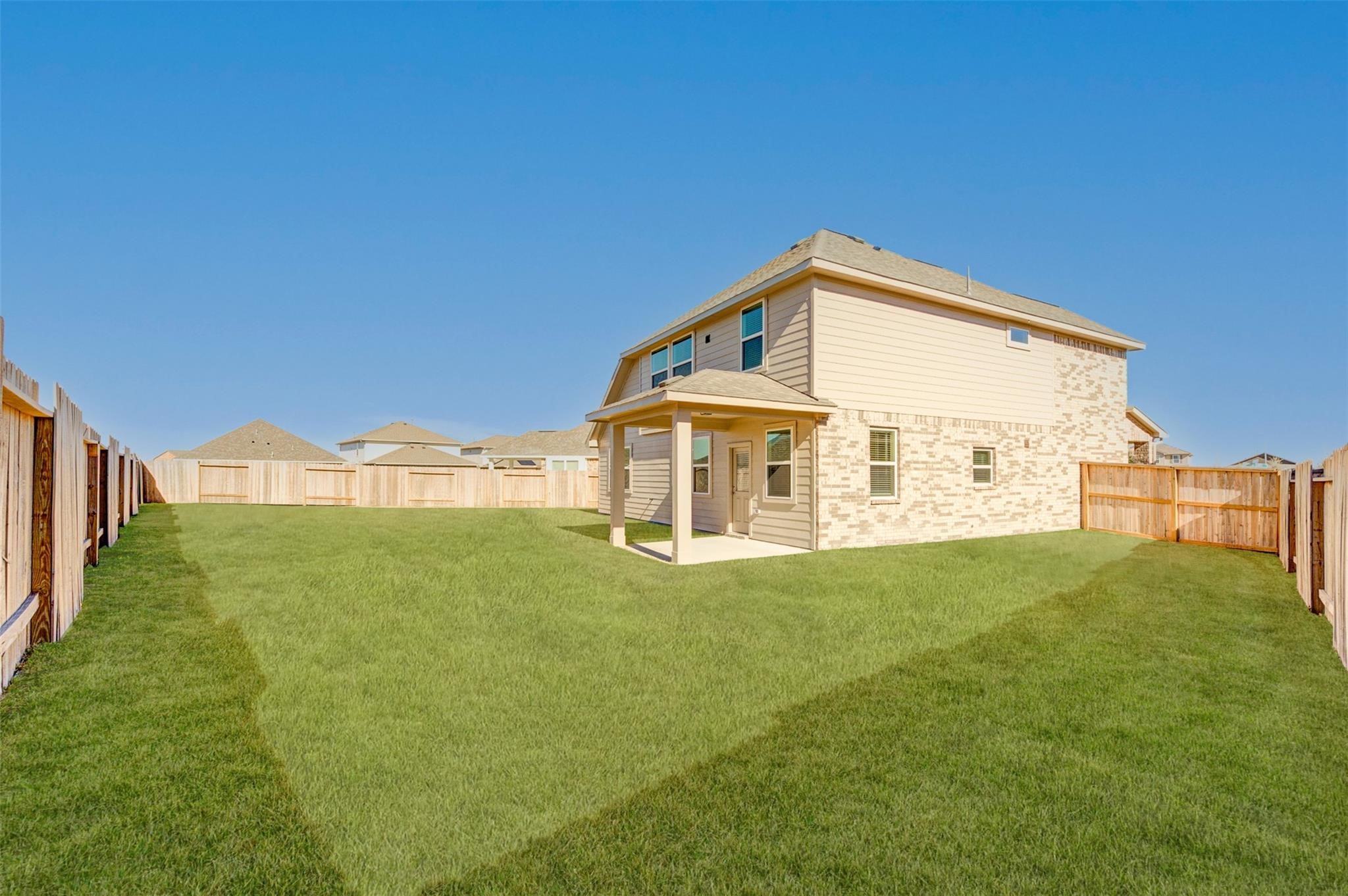 10902 Granite Chief Drive Rosharon, TX 77583 - Photo 29 of 32 a view of a big house with a big yard