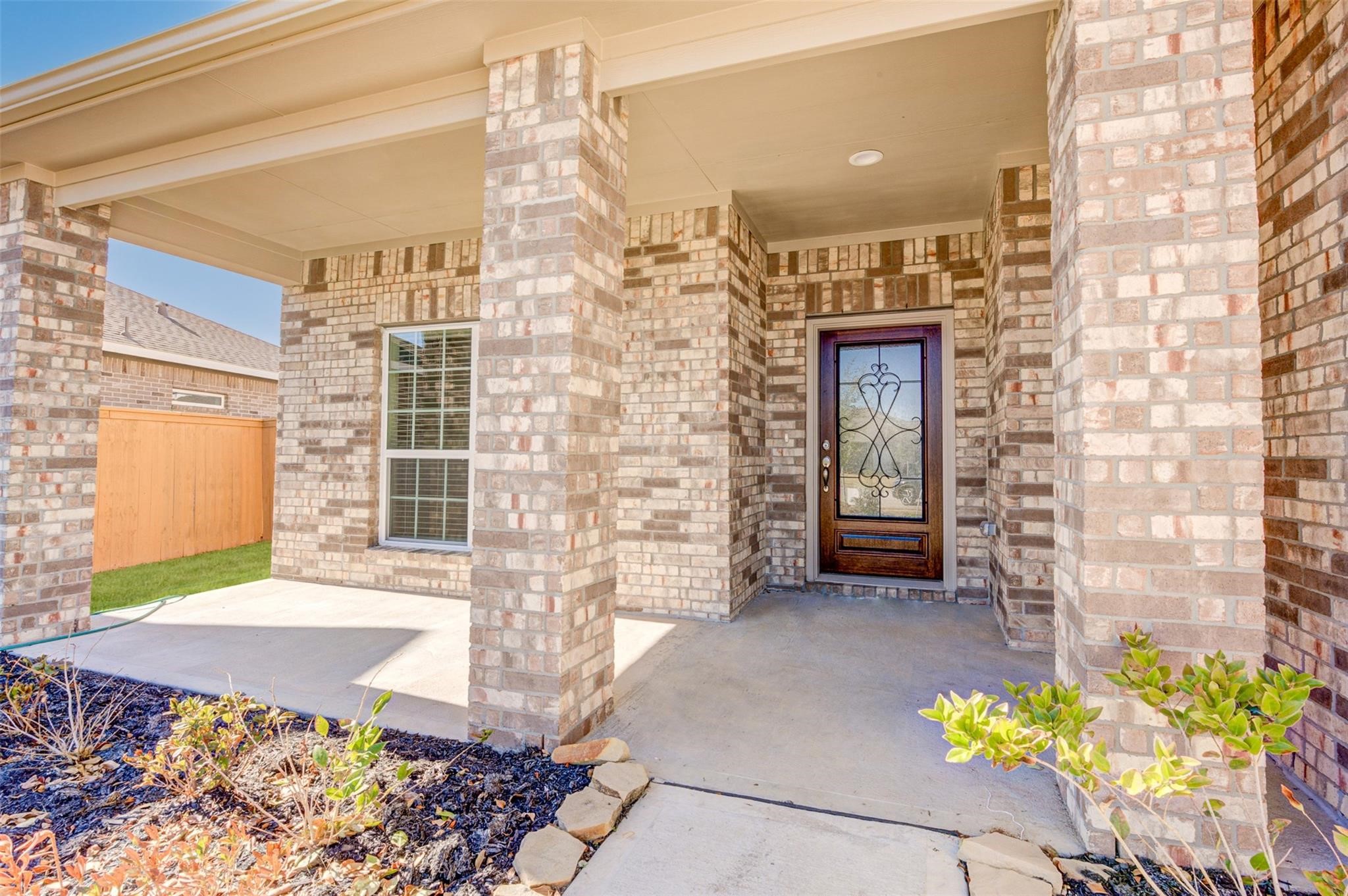 10902 Granite Chief Drive Rosharon, TX 77583 - Photo 4 of 32 a front view of a house with a yard