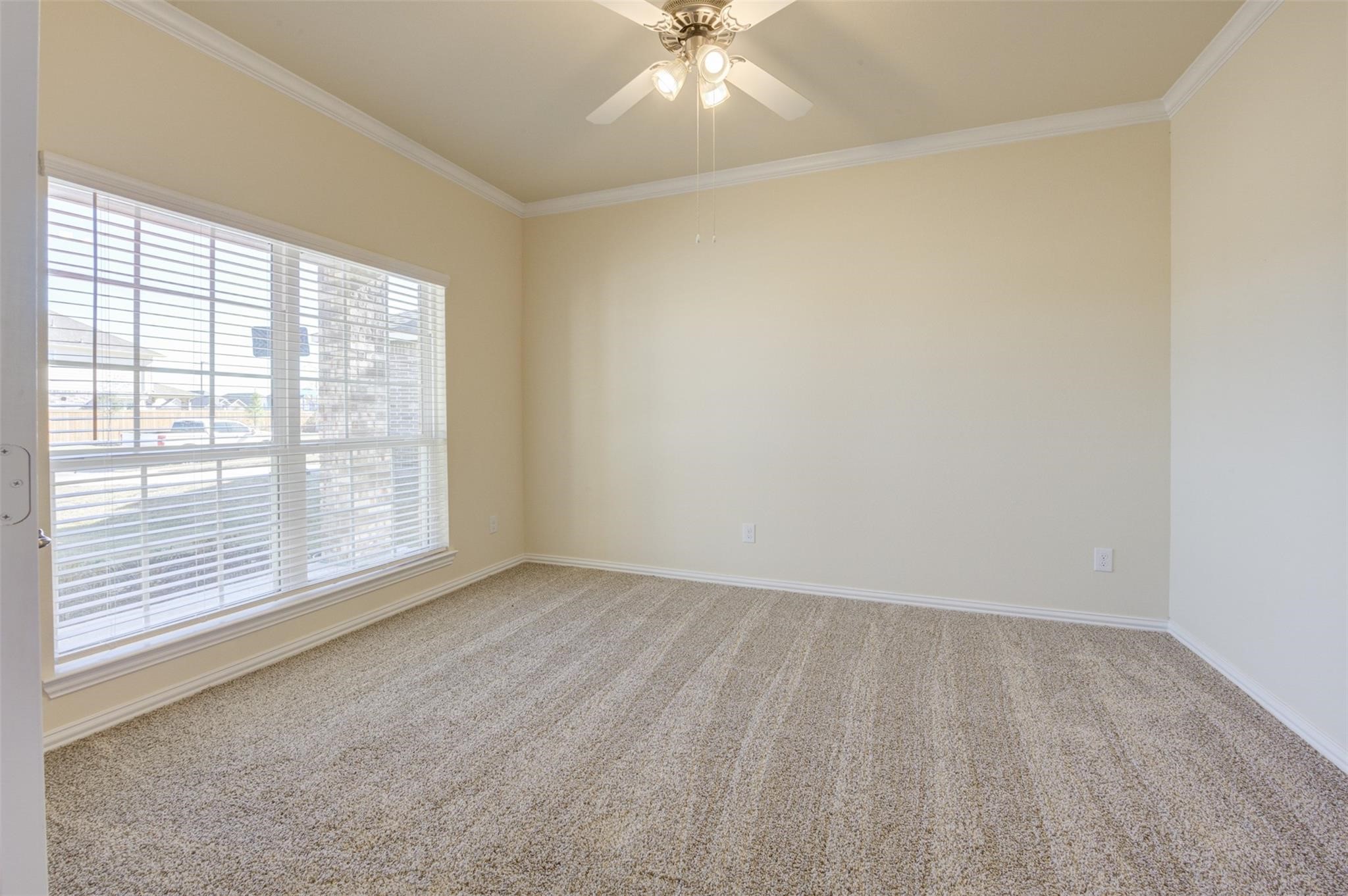 10902 Granite Chief Drive Rosharon, TX 77583 - Photo 5 of 32 a view of an empty room with a window