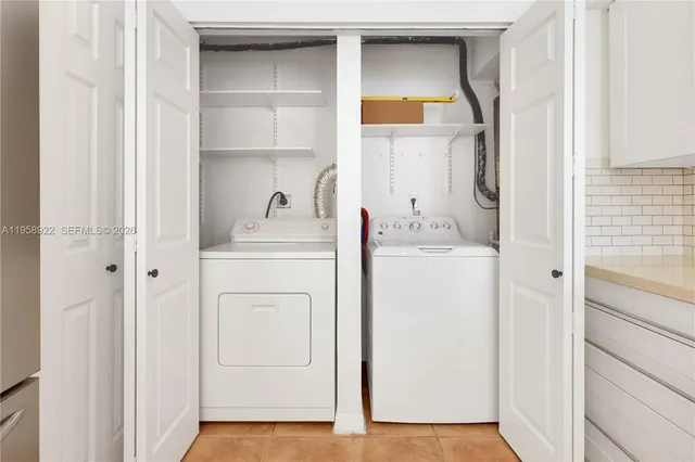 a utility room with closet dryer and washer