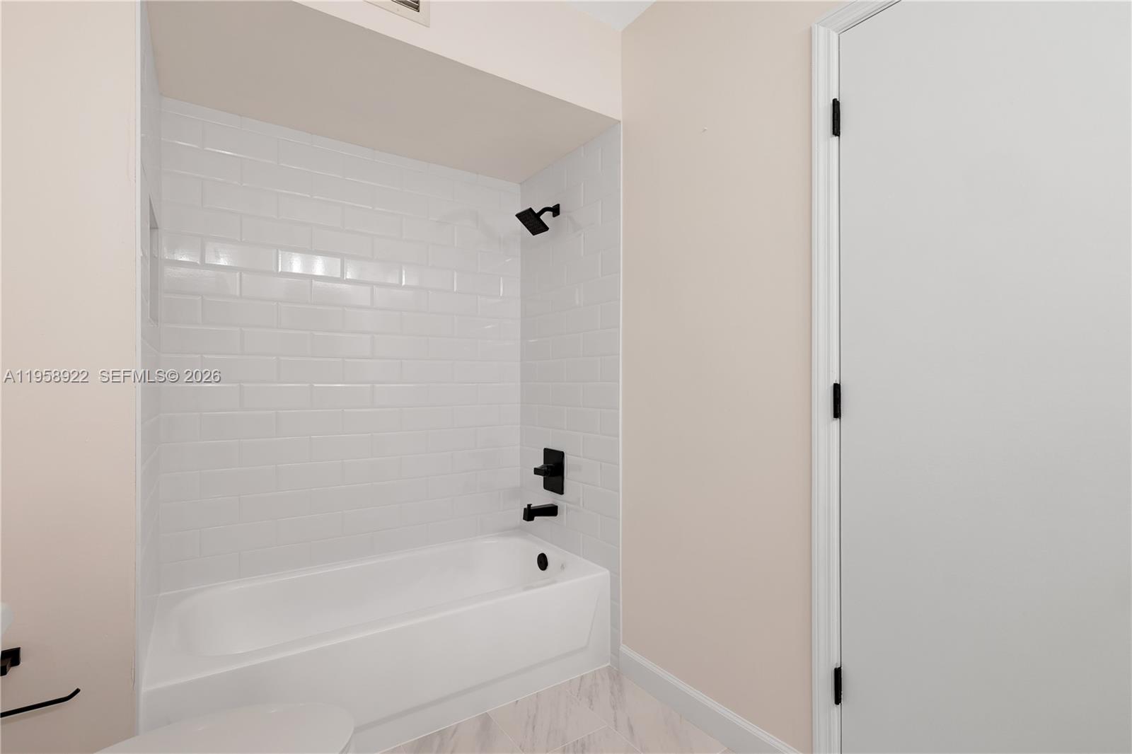 5467 Southwest 125th Terrace Miramar, FL 33027 - Photo 21 of 42 a bathroom with a bathtub