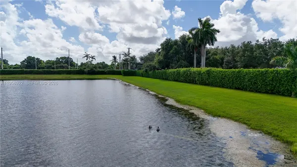 a view of a lake with a big yard