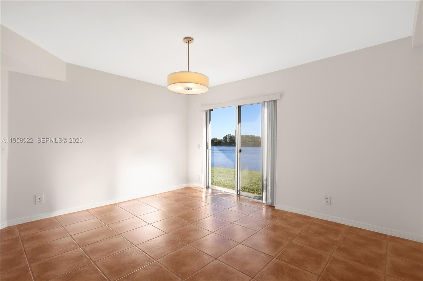 5467 Southwest 125th Terrace Miramar, FL 33027 - Photo 8 of 42 a view of an empty room with a window