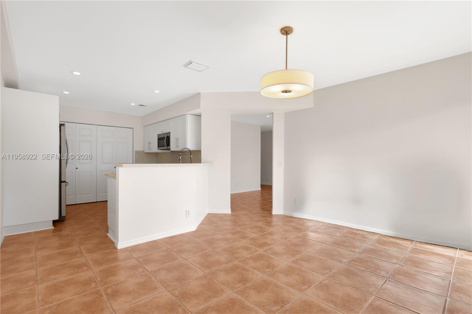 5467 Southwest 125th Terrace Miramar, FL 33027 - Photo 10 of 42 a view of a kitchen with an empty space and a window