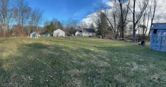 a view of a fire pit with large trees
