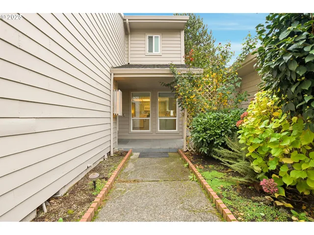 a view of house with backyard