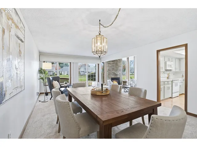 a view of a dining room with furniture window and outside view
