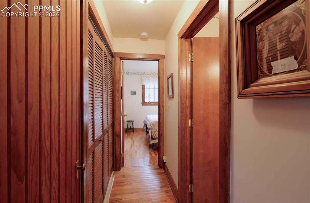 9455 Mohawk Trail Cascade, CO 80809 - Photo 14 of 33 Hallway to guest bedroom and bath. One your left is a coat closet and Washer/Dryer