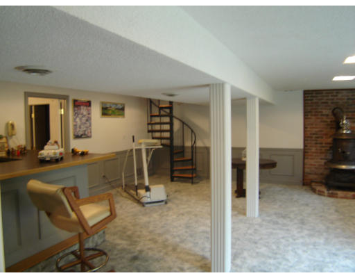 67 White Loaf Road Southampton, MA 01073 - Photo 6 of 10 a view of a livingroom with furniture and a flat screen tv