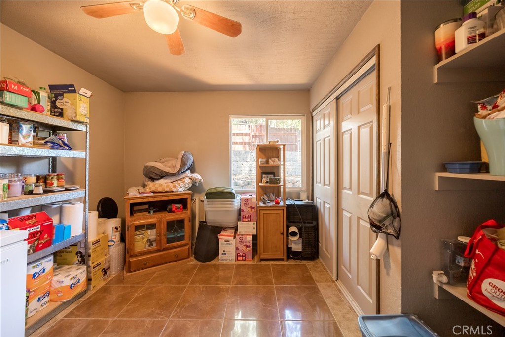 519 South Dart Canyon Road Crestline, CA 92325 - Photo 19 of 26 a view of a workspace with furniture and a window