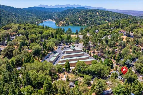 a view of a lush green hillside and a houses