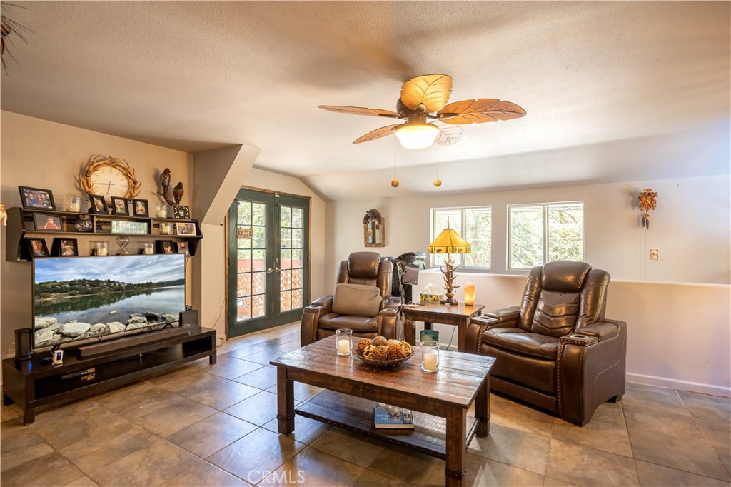 519 South Dart Canyon Road Crestline, CA 92325 - Photo 10 of 26 a living room with furniture and a flat screen tv