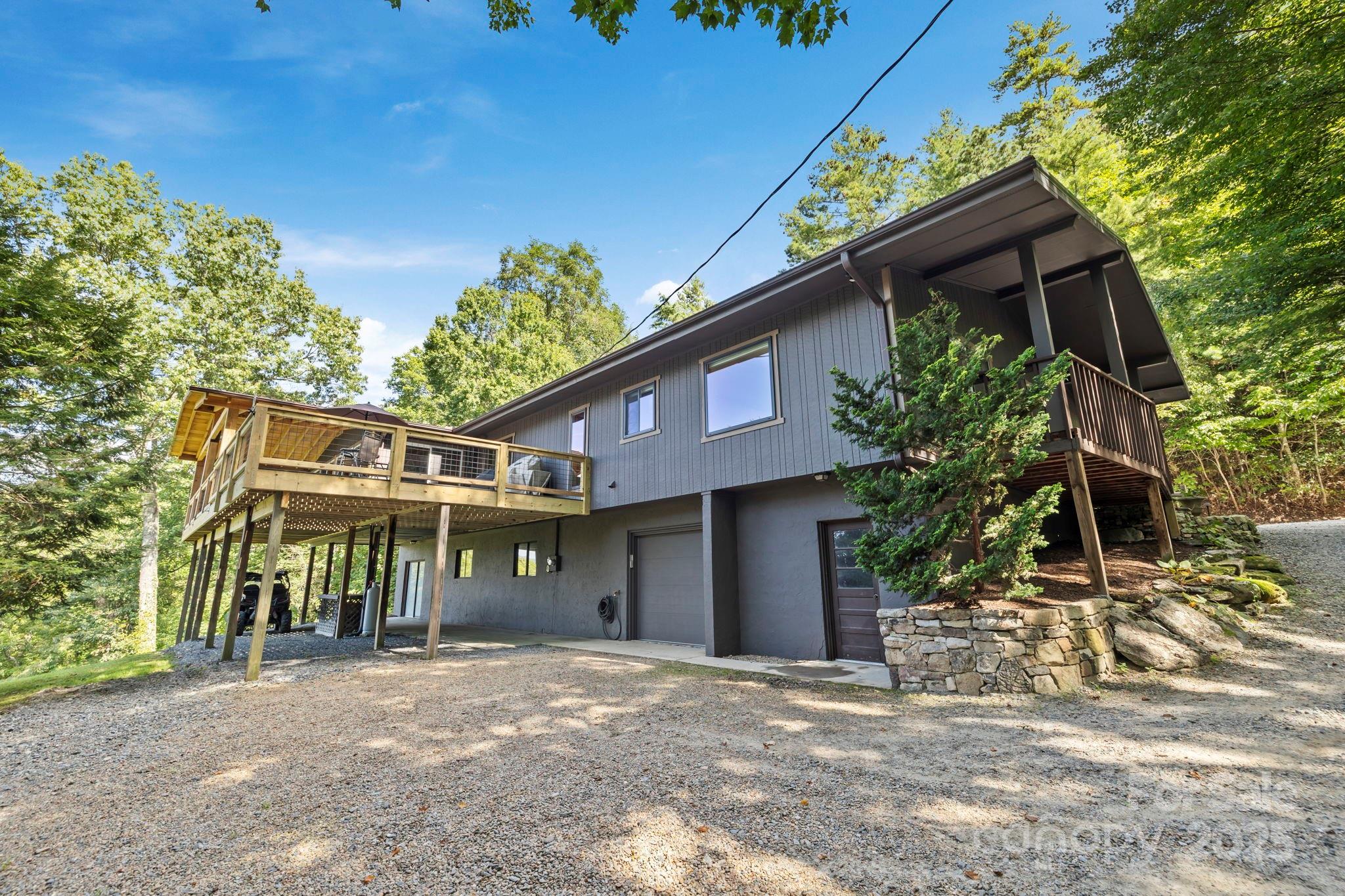 658 Johnson Road Brevard, NC 28712 - Photo 12 of 48 a front view of a house with a yard