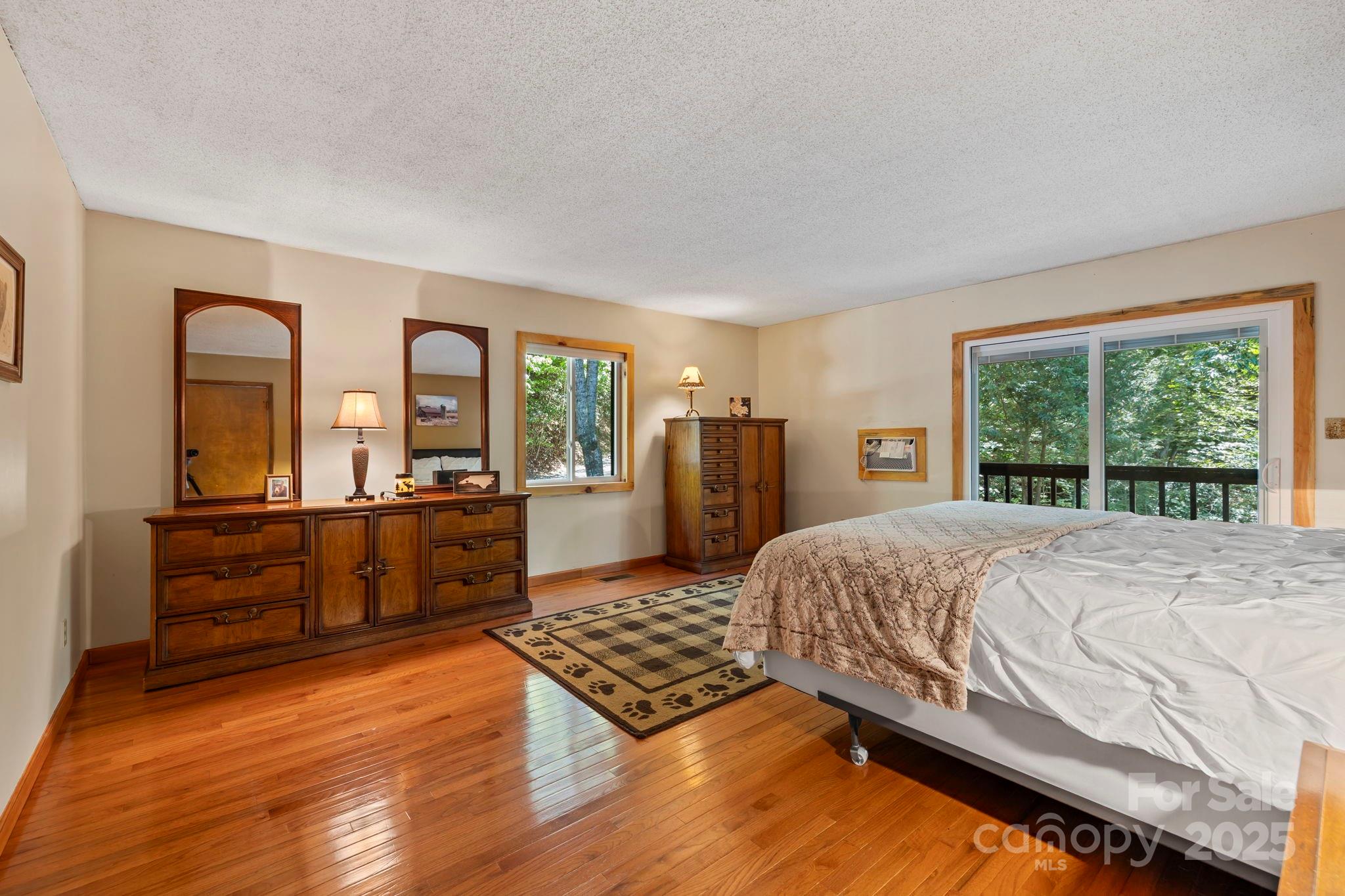 658 Johnson Road Brevard, NC 28712 - Photo 29 of 48 a bed sitting in a bedroom next to a window