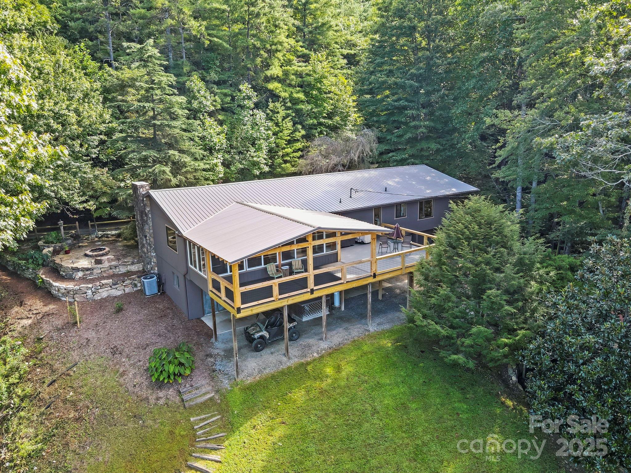 658 Johnson Road Brevard, NC 28712 - Photo 42 of 48 an aerial view of a house with a yard table and chairs