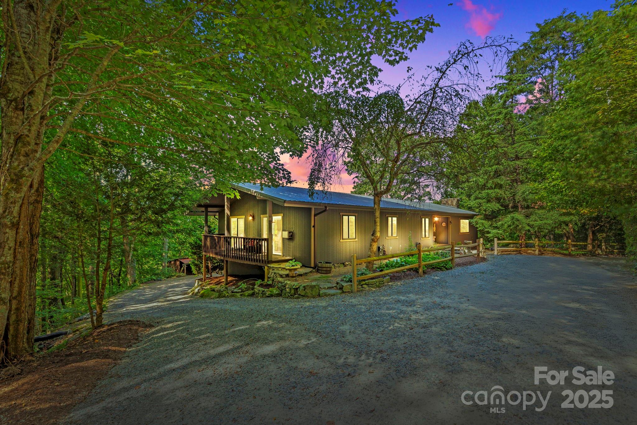 658 Johnson Road Brevard, NC 28712 - Photo 9 of 48 a view of a house with a yard