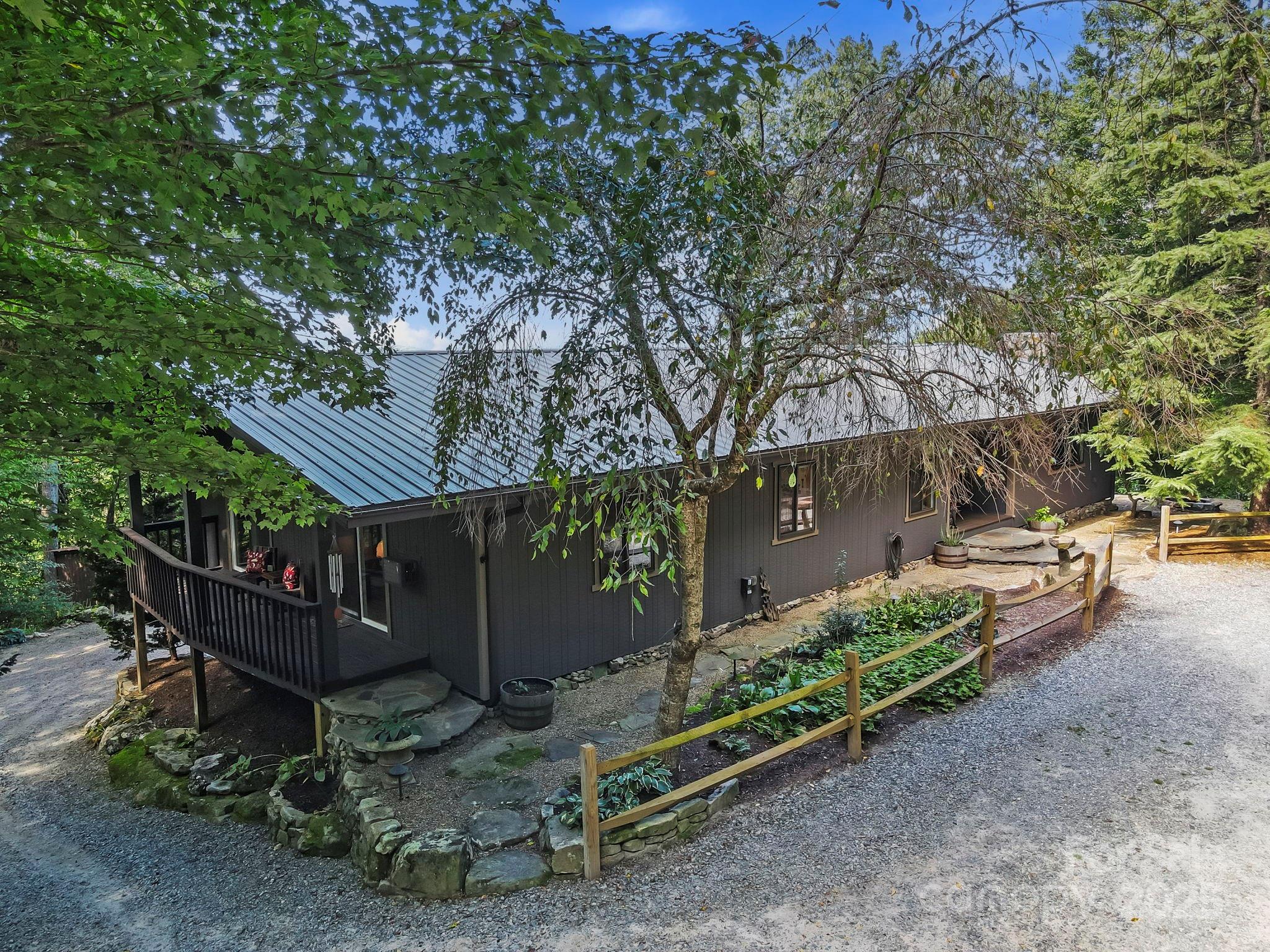 658 Johnson Road Brevard, NC 28712 - Photo 10 of 48 a view of backyard with deck and seating space