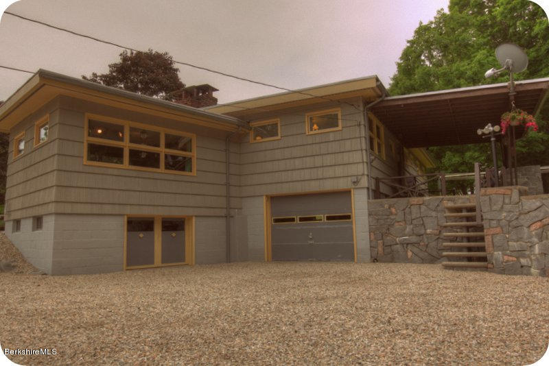 195 Main Road Monterey, MA 01245 - Photo 21 of 30 a front view of a house with a yard