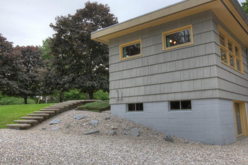 195 Main Road Monterey, MA 01245 - Photo 23 of 30 a front view of a house with a yard