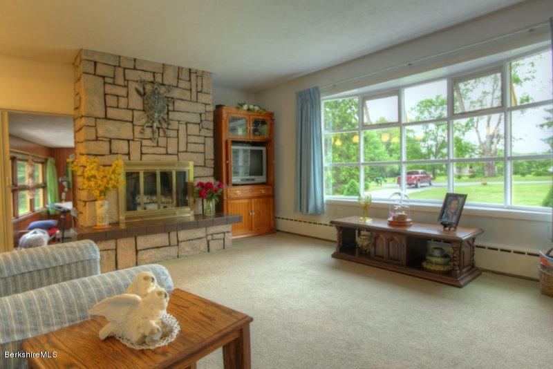 195 Main Road Monterey, MA 01245 - Photo 25 of 30 a living room with furniture and a floor to ceiling window