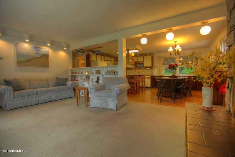 195 Main Road Monterey, MA 01245 - Photo 27 of 30 a living room with furniture and a chandelier