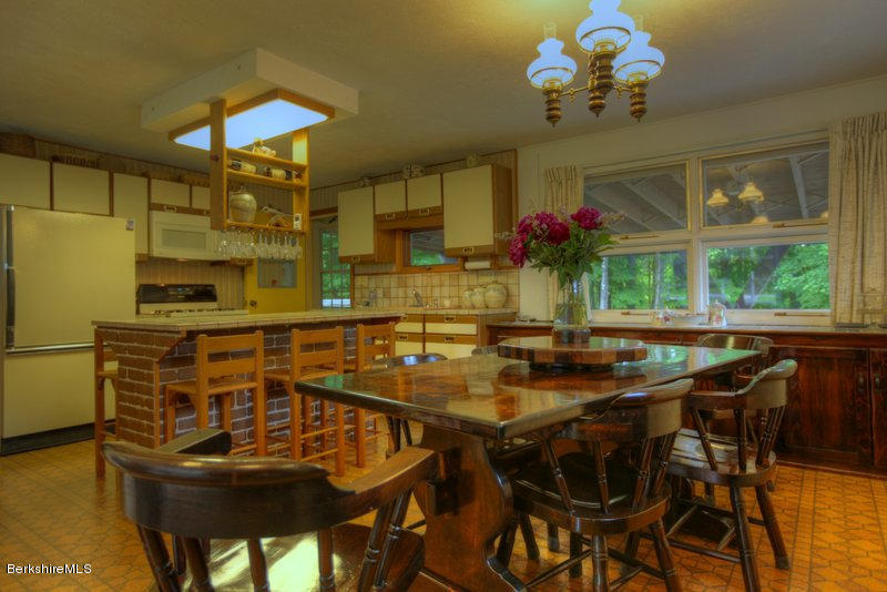 195 Main Road Monterey, MA 01245 - Photo 28 of 30 a view of a dining room with furniture and chandelier