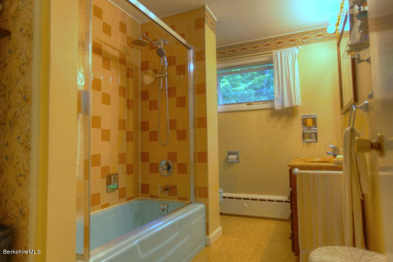 195 Main Road Monterey, MA 01245 - Photo 29 of 30 a bathroom with a bathtub and a shower