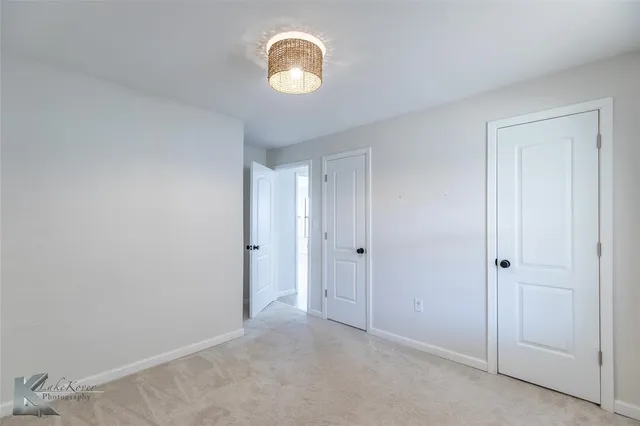 a bathroom with 2 sink and a mirror