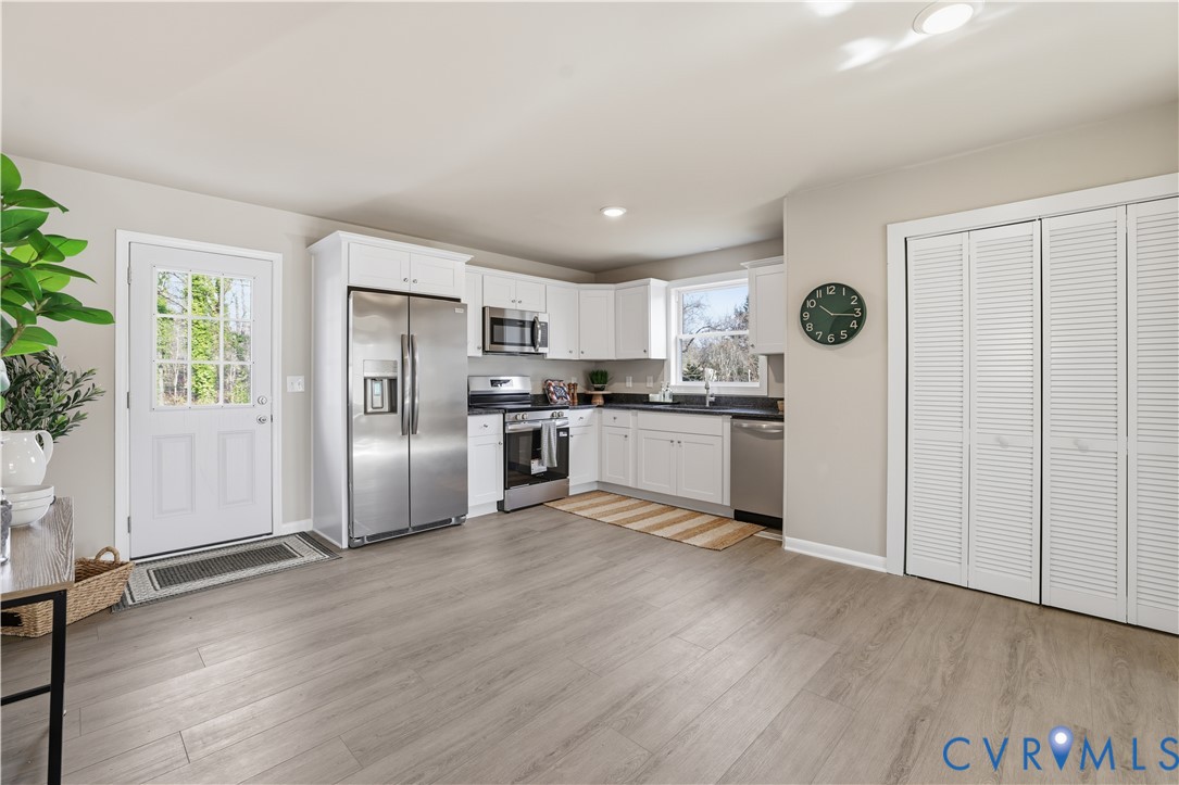 4400 Treely Road Chester, VA 23831 - Photo 19 of 34 a kitchen with stainless steel appliances a refrigerator sink and microwave