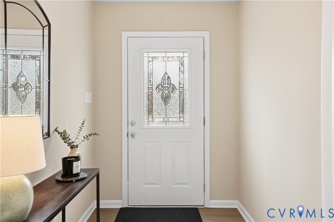 4400 Treely Road Chester, VA 23831 - Photo 23 of 34 a room with a door and wooden floor