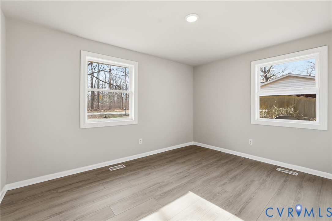 4400 Treely Road Chester, VA 23831 - Photo 26 of 34 a view of a big room with wooden floor and windows