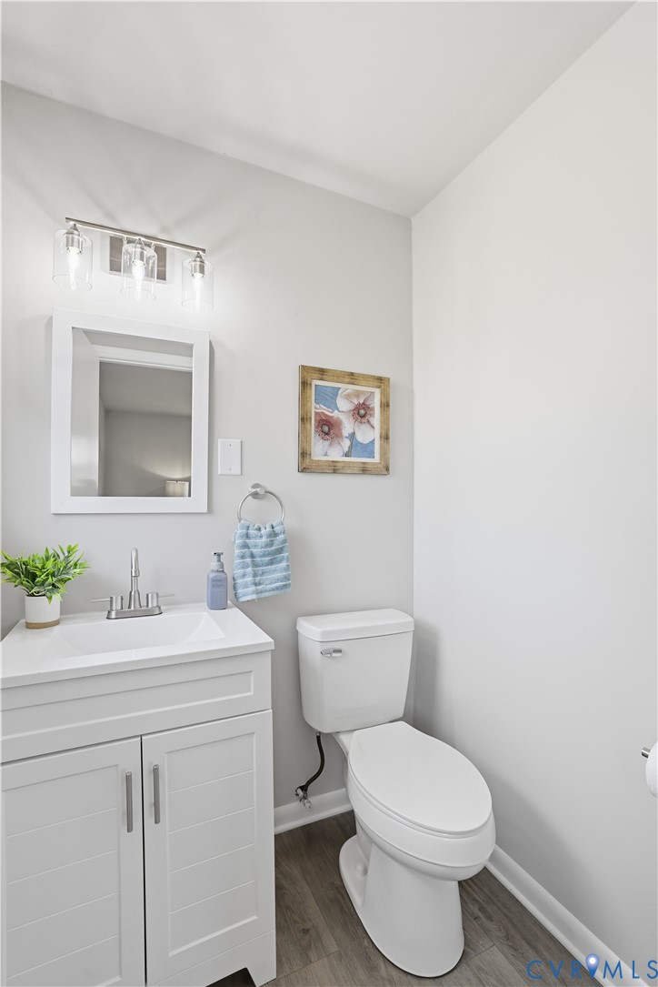 4400 Treely Road Chester, VA 23831 - Photo 31 of 34 a bathroom with a toilet a sink and mirror