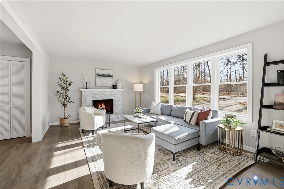 4400 Treely Road Chester, VA 23831 - Photo 7 of 34 a living room with furniture large window and a fireplace