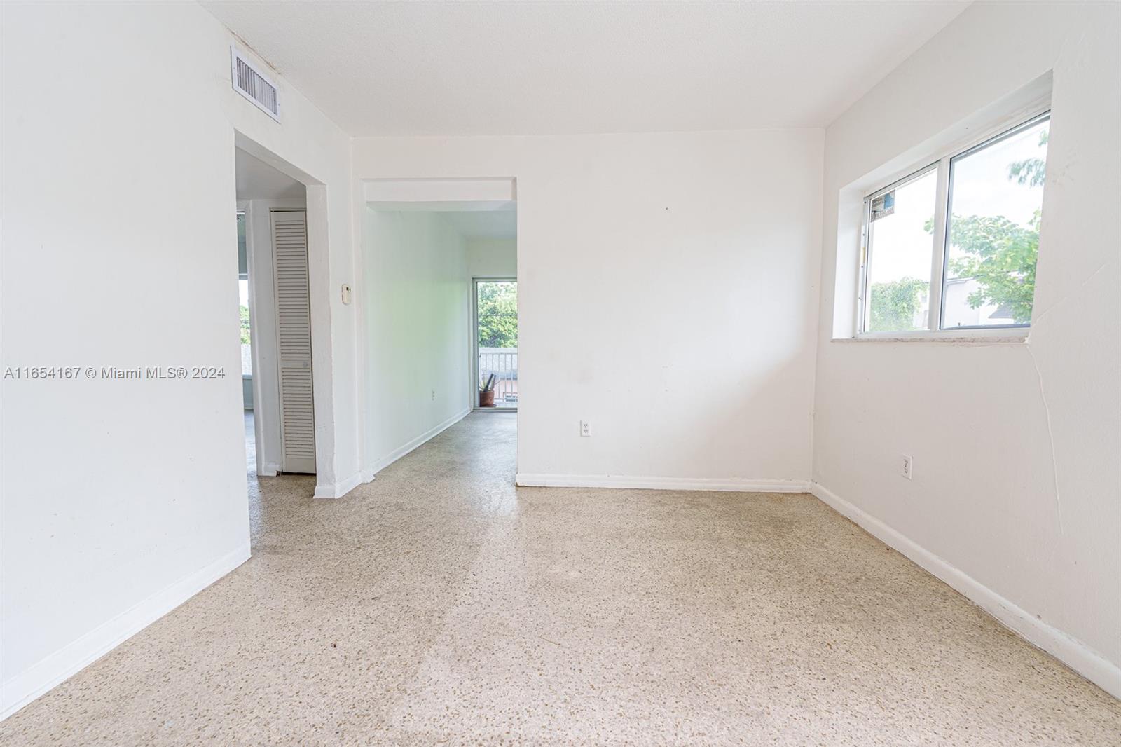 621 Southwest 15th Avenue, Unit 4 Miami, FL 33135 - Photo 19 of 22 an empty room with a window