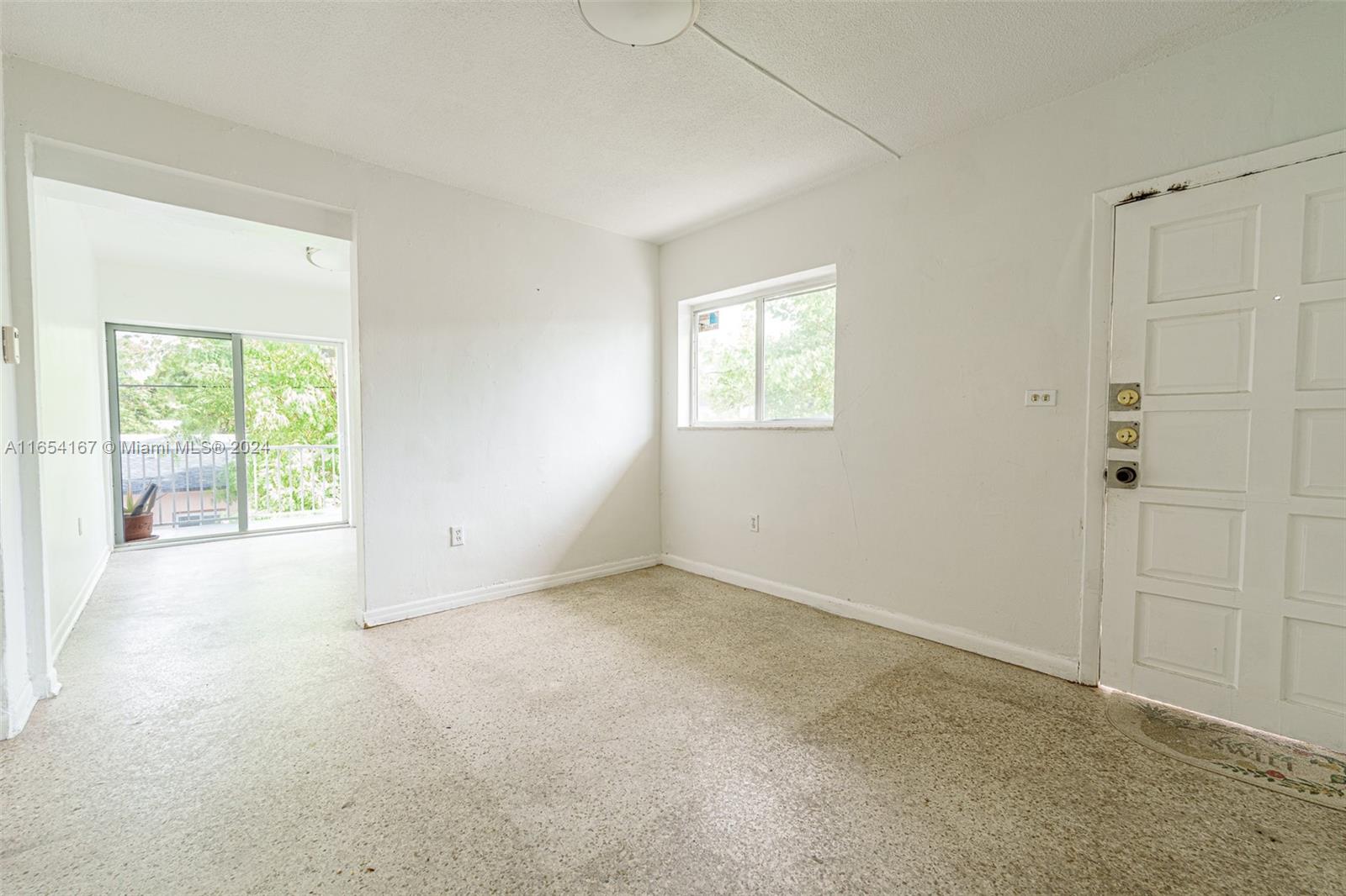 621 Southwest 15th Avenue, Unit 4 Miami, FL 33135 - Photo 20 of 22 an empty room with windows