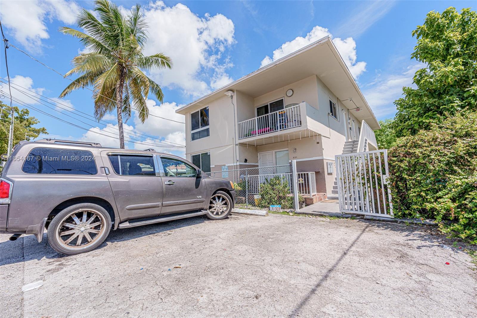 621 Southwest 15th Avenue, Unit 4 Miami, FL 33135 - Photo 2 of 22 a front view of a house with parking space