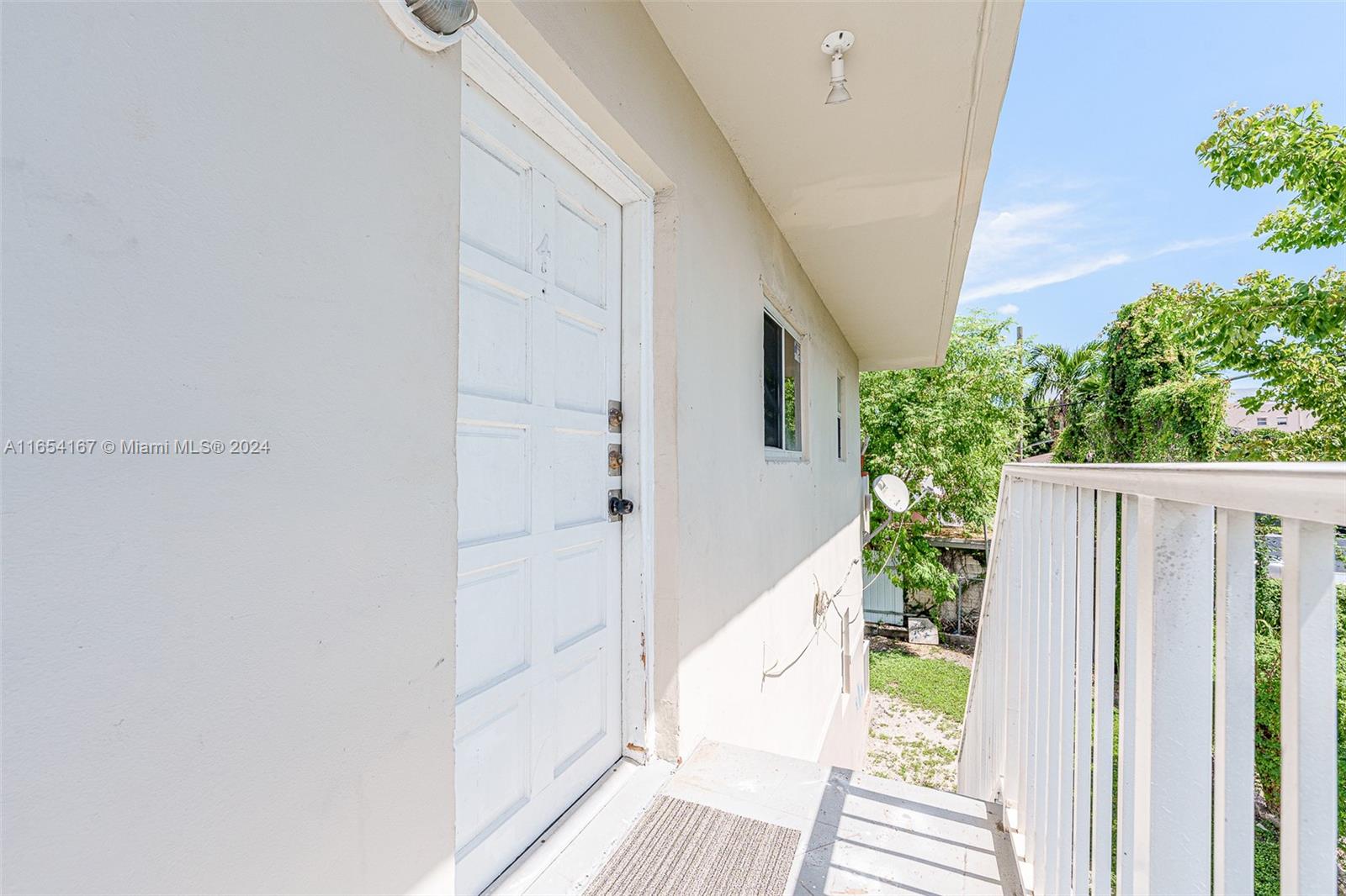 621 Southwest 15th Avenue, Unit 4 Miami, FL 33135 - Photo 22 of 22 a view of a balcony with wooden floor