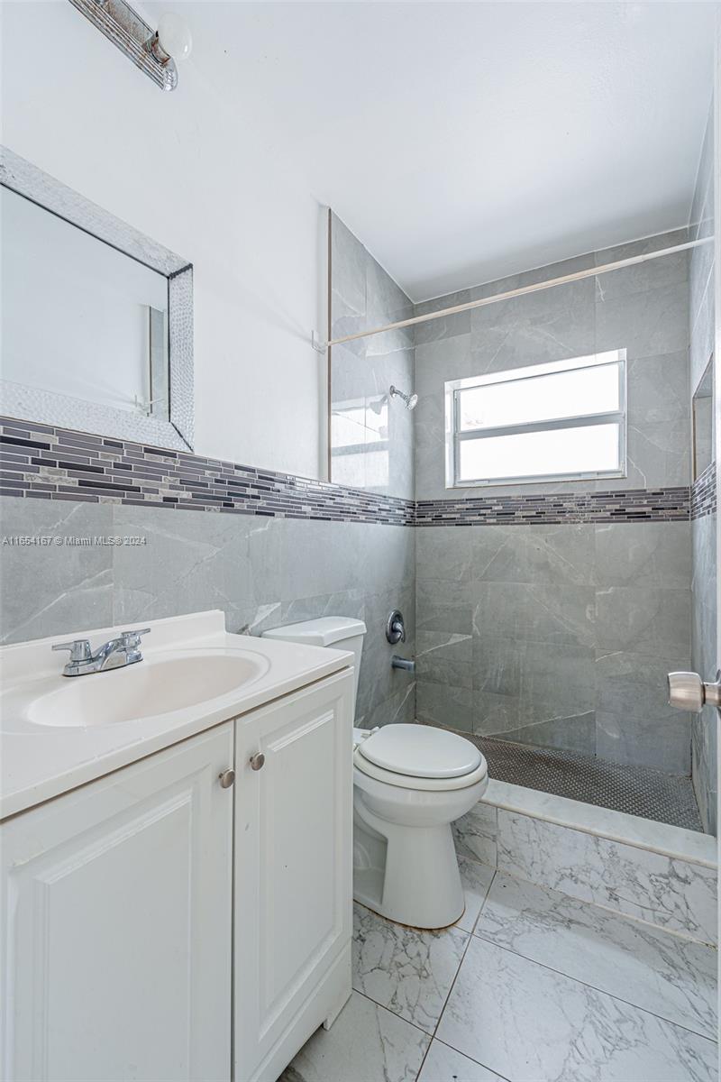621 Southwest 15th Avenue, Unit 4 Miami, FL 33135 - Photo 8 of 22 a bathroom with a sink toilet and shower