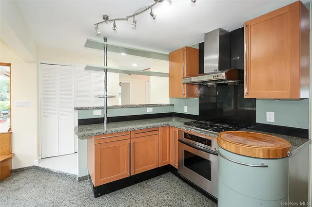 a kitchen with a sink stove and microwave