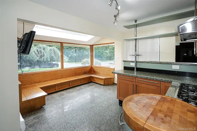 a room with natural light and furniture