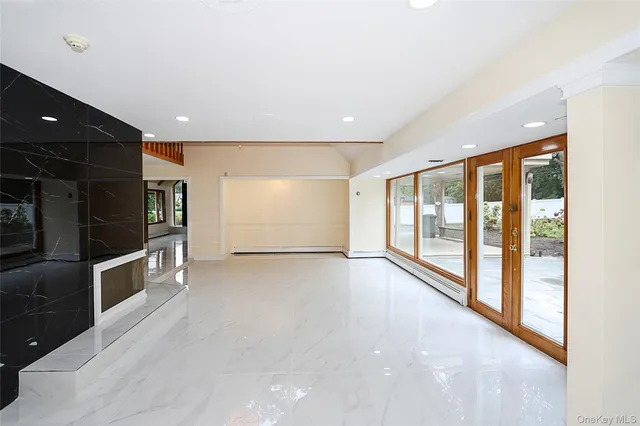 a view of an empty room with a large window