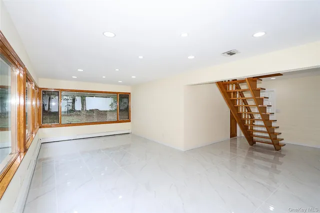 a view of an empty room with a large window