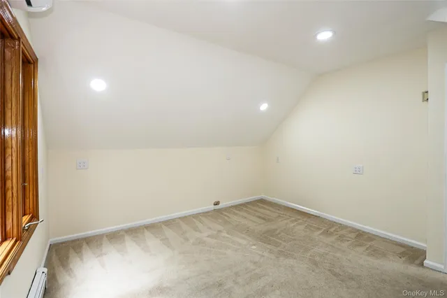 an empty room with large windows