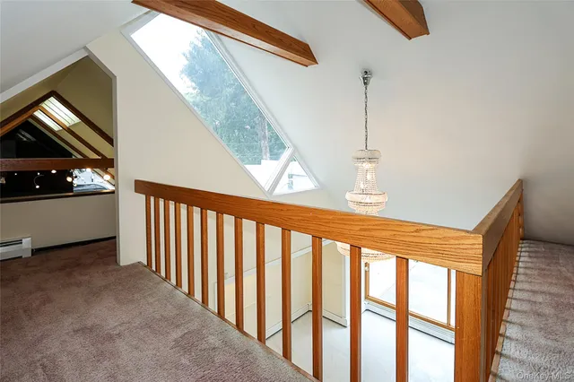 a bathroom with a sink a toilet and a window