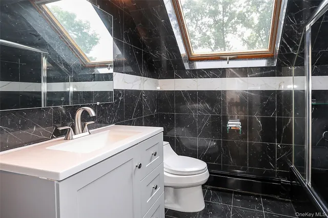 a view of a hallway with stairs