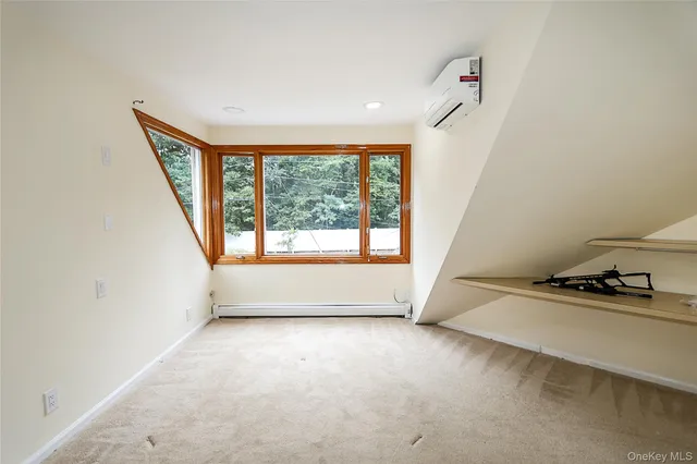 a view of a chairs and table in the back yard of the house