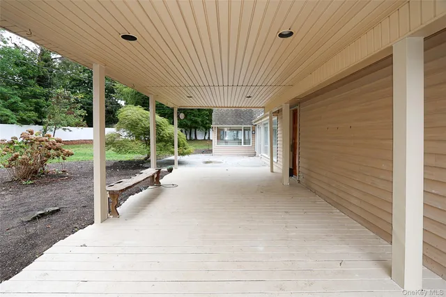 a view of a house with backyard and a car parked