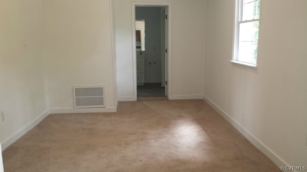 3564 Athey Road Sandy Hook, VA 23153 - Photo 4 of 12 an empty room with windows