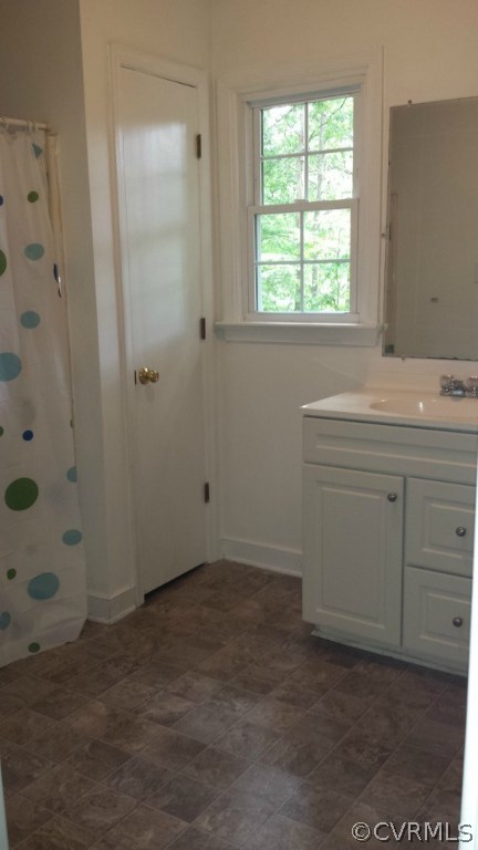 3564 Athey Road Sandy Hook, VA 23153 - Photo 8 of 12 an empty room with a window and vanity